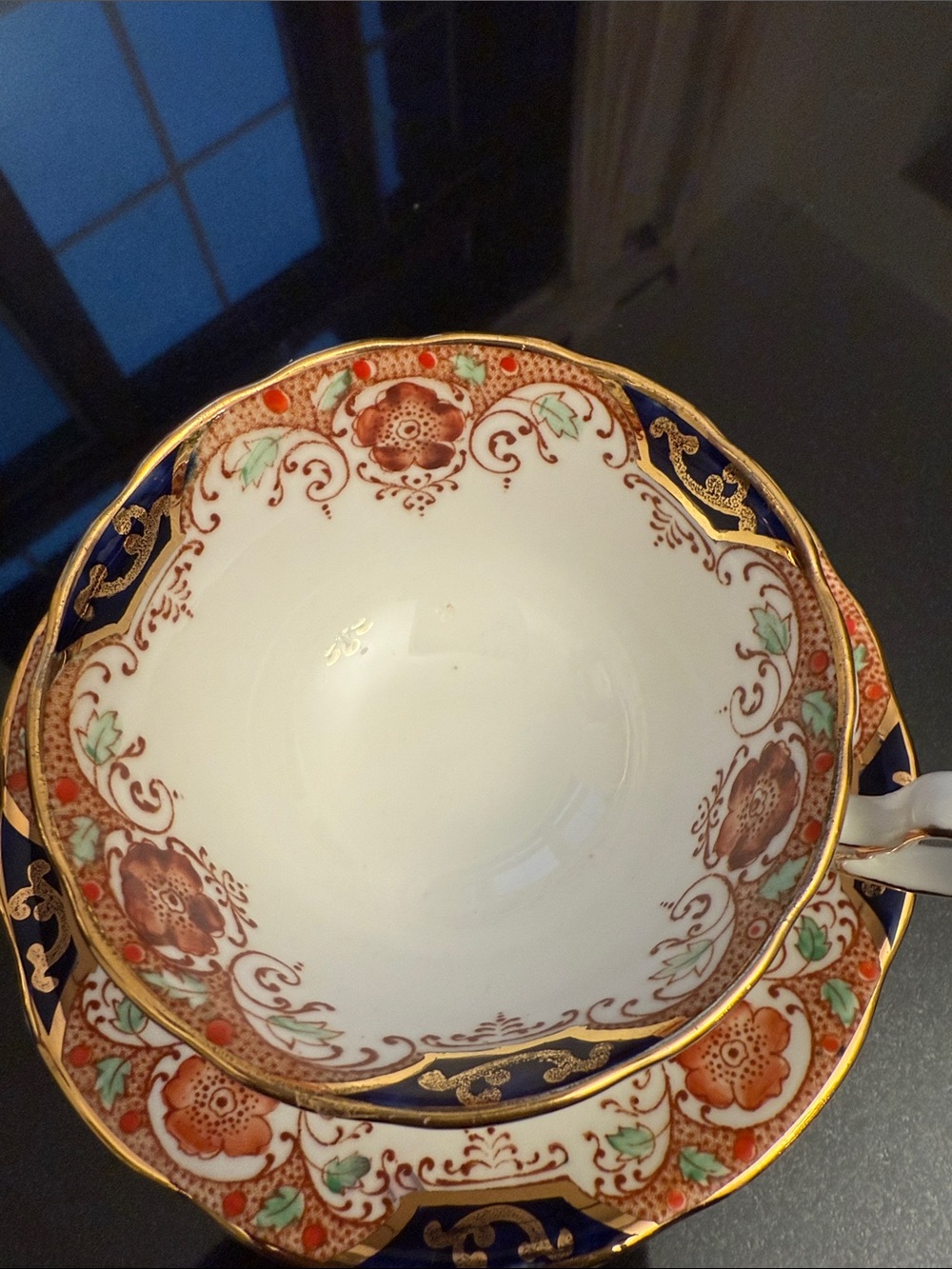Decorative White and Navy Porcelain Tea Cup with Gold Accents